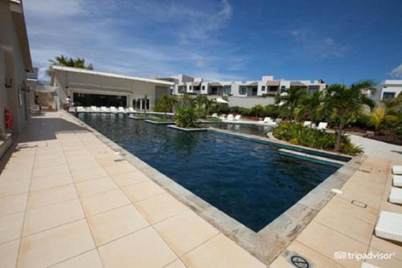 Holiday home Azuri Ocean Village - Elegant 3-bedroom With Private Garden, & Pool Access In *