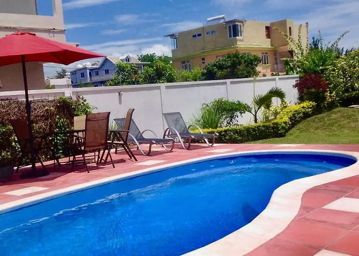 Cardamon Villa Is A 2 Bedroom With 1 Bathroom And Seperate Toilet Detached House With Ac And Swimming Pool , 5 Minutes Walk From Flic En Flac Public Beach